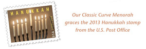 Picture of a USPS Hanukkah stamp showing a menorah from Blackthorne Forge in Vermont 