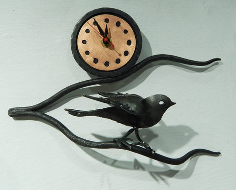 Bird on a branch with clock. Forged iron from Blackthorne Forge in Vermont.